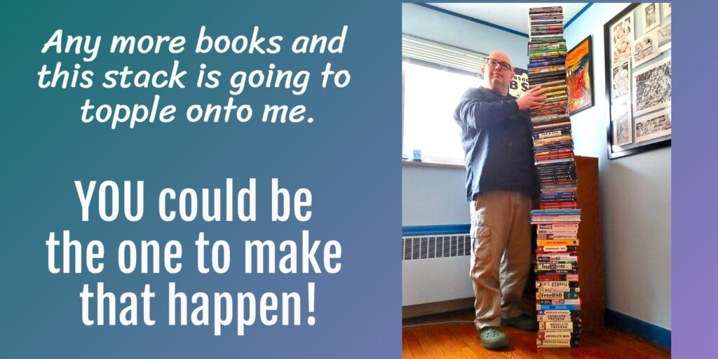 the author next to a tottering stack of books he wrote